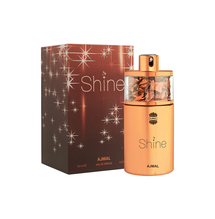 Ajmal Shine Eau De Parfum for Women, elegant glass bottle with floral and citrus fragrance notes, displayed on a neutral background.