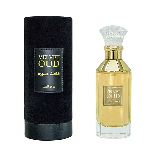 Lattafa Velvet Oud Edp 100ml perfume bottle with elegant design and gold accents, showcasing a luxurious fragrance presentation.
