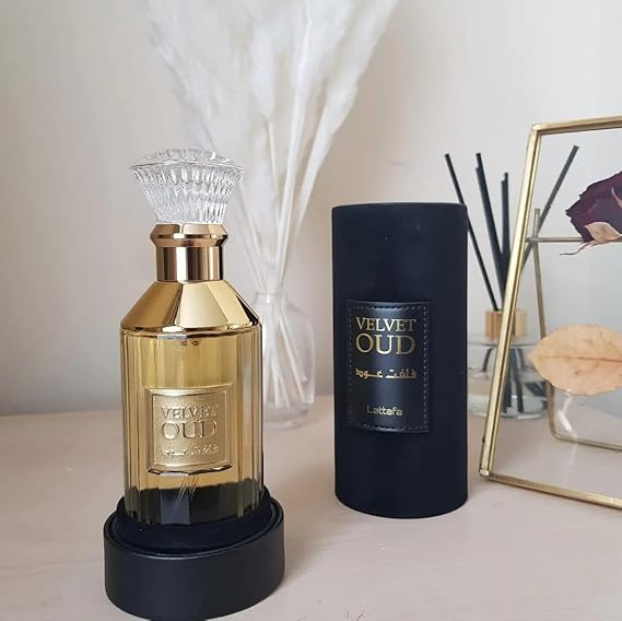 Lattafa Velvet Oud Eau de Parfum 100ml bottle with elegant design and black cap, showcasing luxury fragrance packaging.