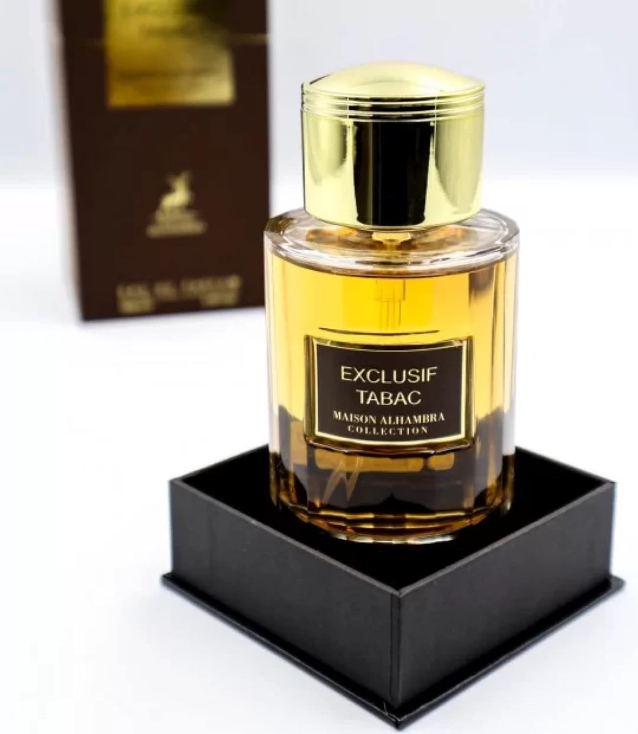 Alhambra Exclusif Tabac 100ml perfume bottle with a sleek design and amber-colored liquid, displayed against a neutral background.