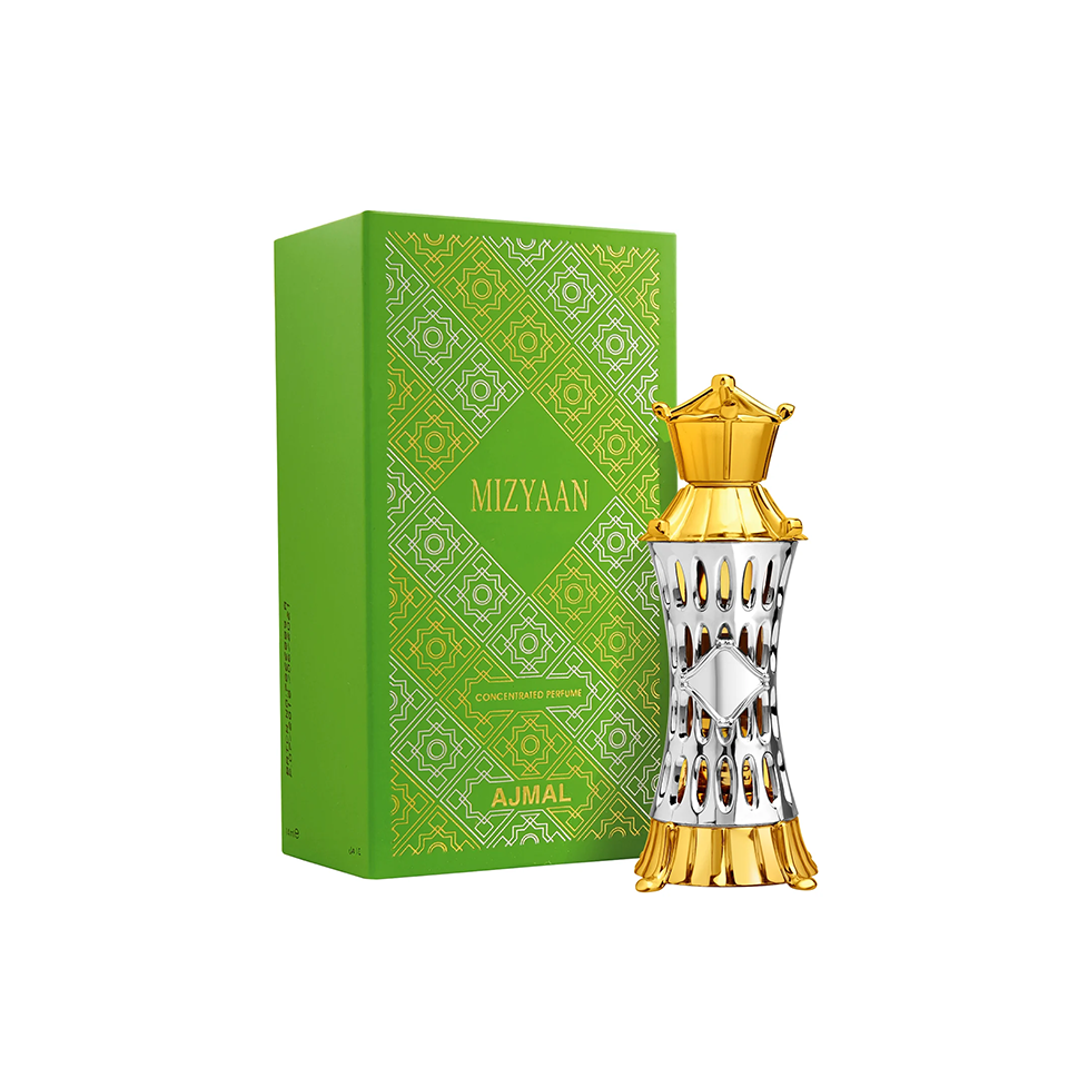 A decorative AJMAL MIZYAAN Concentrated Perfume Oil (Attar) 14ml bottle with gold and silver accents stands beside a green box with gold patterns, highlighting this exquisite unisex fragrance for men and women.