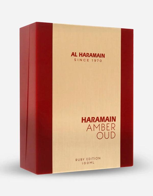 Al Haramain Amber Oud Ruby Edition perfume bottle with gold accents, featuring a deep red liquid and elegant packaging.