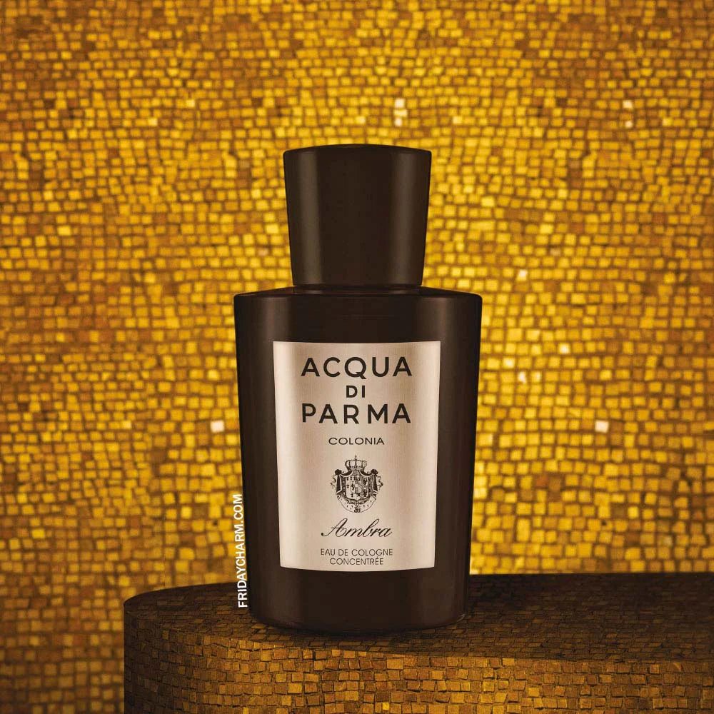 Miniature 5ml bottle of Acqua di Parma Colonia Ambra Eau de Cologne Concentrée for unisex use, with elegant packaging and label.