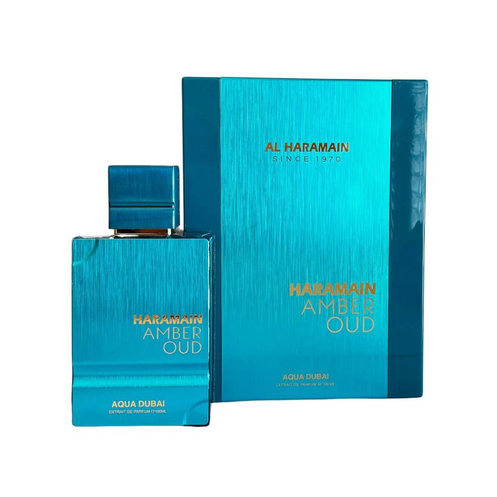 Al Haramain Amber Oud Aqua Dubai perfume bottle, 100ml, for men and women, elegant glass container with amber-colored liquid inside.