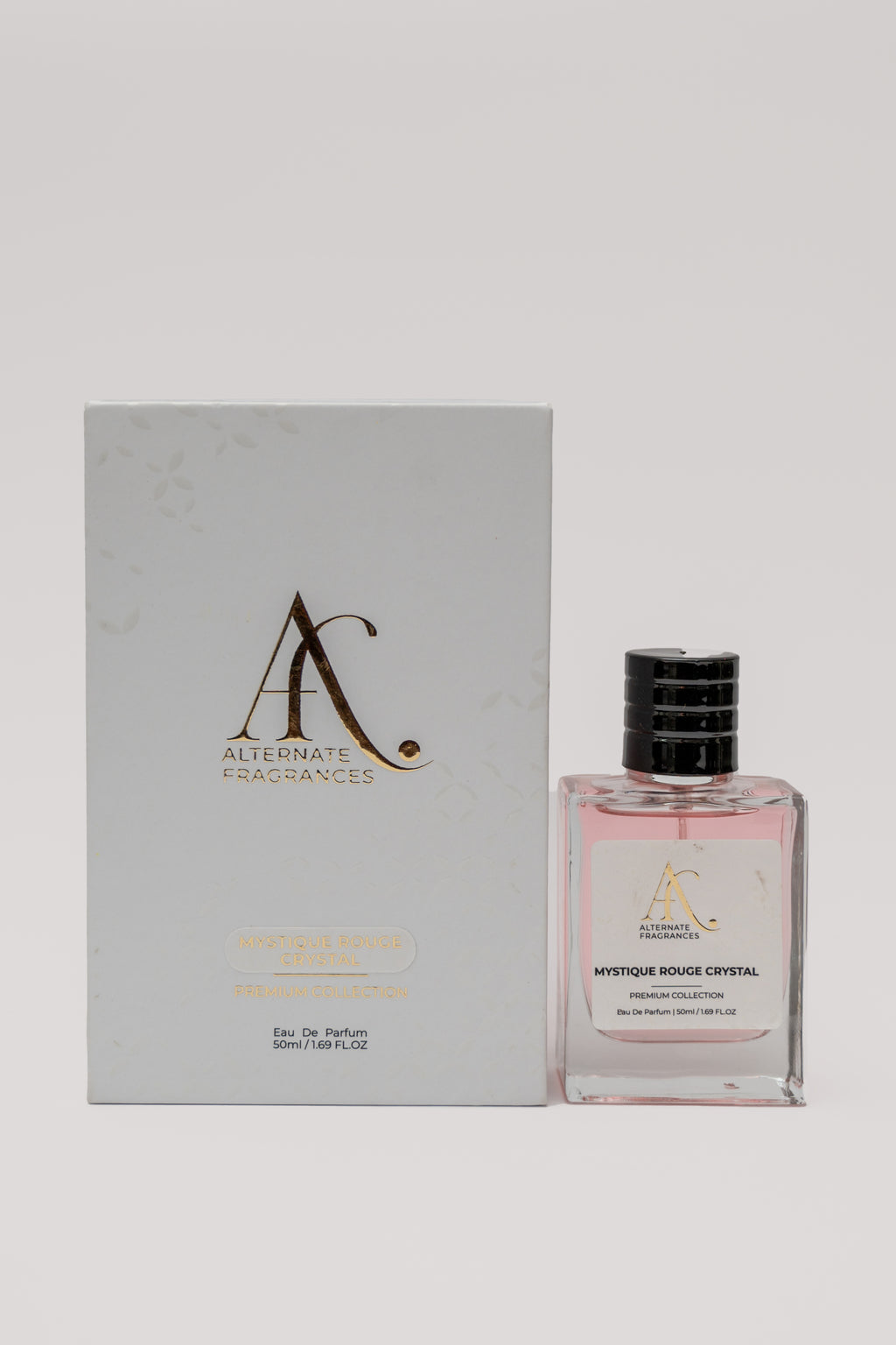 Mystique Rouge Crystal EDP perfume bottle with box, featuring a sleek design and vibrant red accents, by Rini Deals.
