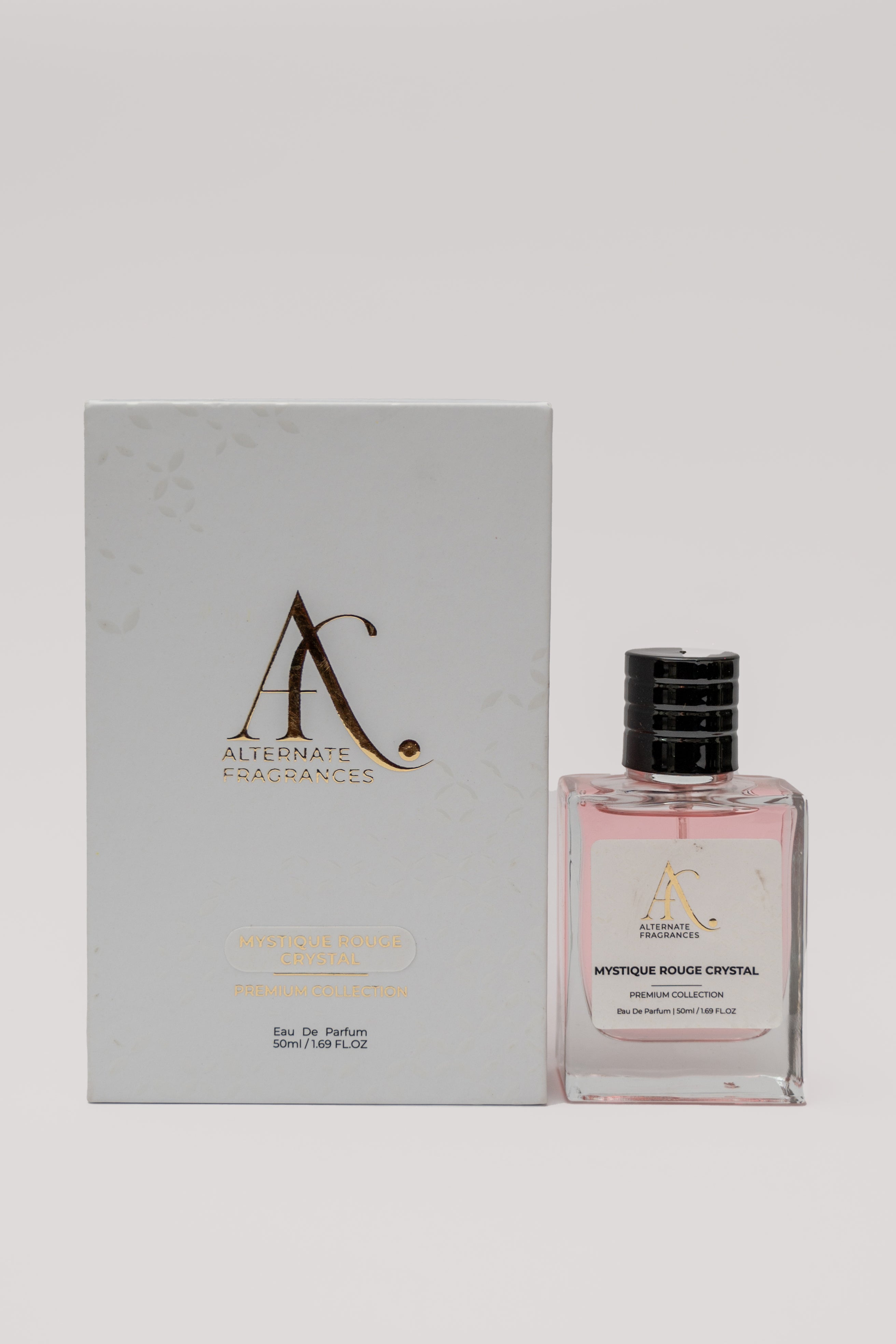 Mystique Rouge Crystal EDP perfume bottle with box, featuring a sleek design and vibrant red accents, by Rini Deals.