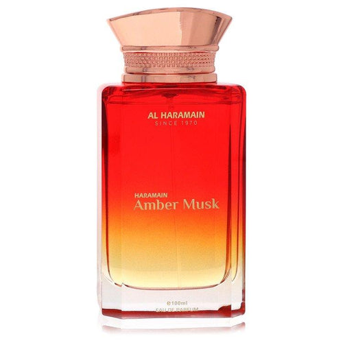 Al Haramain Amber Musk 100ml Eau de Parfum for men and women, bottle with amber-colored liquid and elegant branding.