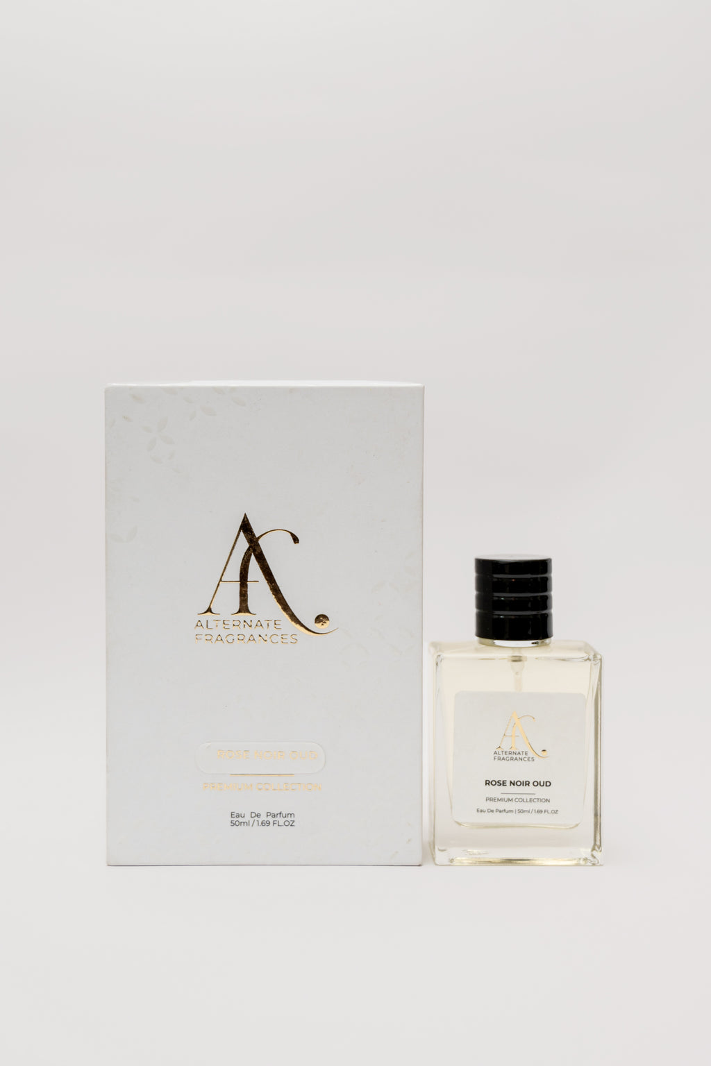 Elegant bottle of Rini Deals Rose Noir Oud EDP with box, showcasing floral and woody notes in a luxurious fragrance presentation.