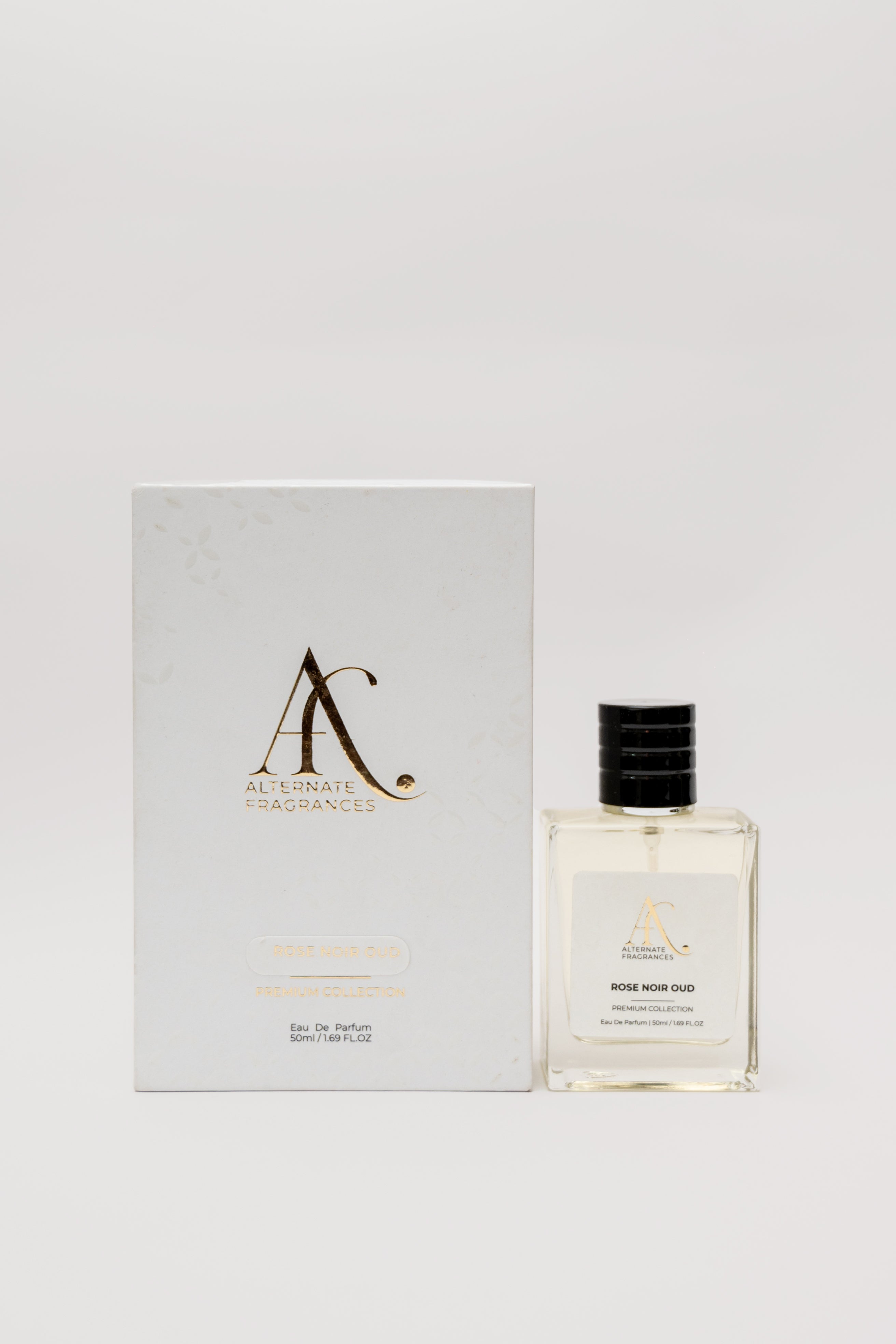 Elegant bottle of Rini Deals Rose Noir Oud EDP with box, showcasing floral and woody notes in a luxurious fragrance presentation.
