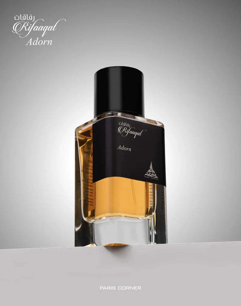 Paris Corner Rifaaqat Adorn Eau De Parfum 85ml bottle for men and women, elegant fragrance in a stylish glass bottle.