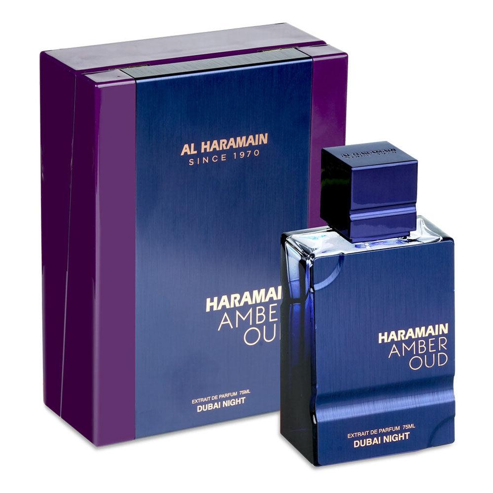 Al Haramain Amber Oud Dubai Night extrait de parfum bottle for men and women, with gold and amber accents and elegant black cap.