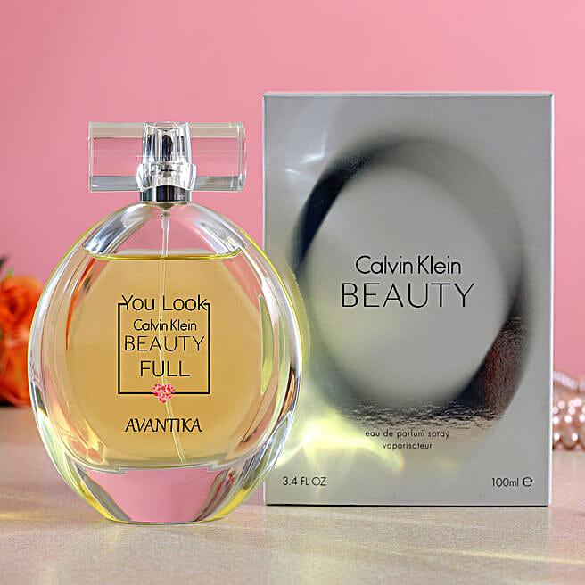 Calvin Klein Beauty Eau De Parfum 100ml bottle for women, elegant glass perfume bottle with gold cap and floral accents.