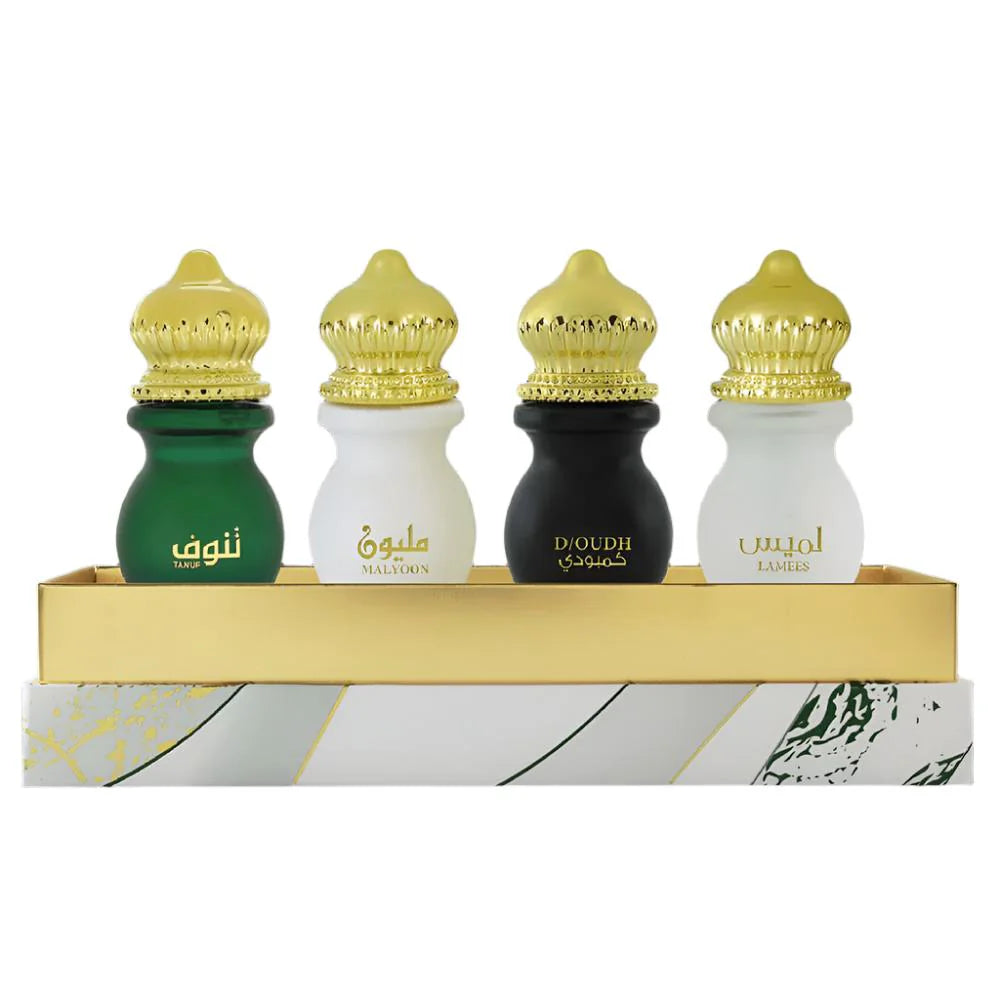 Set of four Ahmed Al Maghribi Atri Attar bottles, 12ml each, featuring traditional perfume oils in elegant packaging.