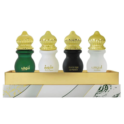 Set of four Ahmed Al Maghribi Atri Attar bottles, 12ml each, featuring traditional perfume oils in elegant packaging.