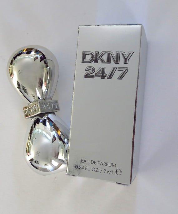 Miniature DKNY 24/7 Eau De Parfum 7ml for women, showcasing the small perfume bottle with elegant packaging.