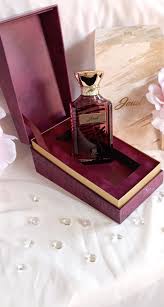 Ahmed Al Maghribi Red Jewel Eau de Parfum for men, 100ml bottle, with red liquid and elegant packaging.