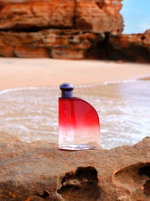 Calvin Klein Nautica Red Eau De Toilette 100ml for men with sleek bottle and vibrant red fragrance, shown in a modern setting.