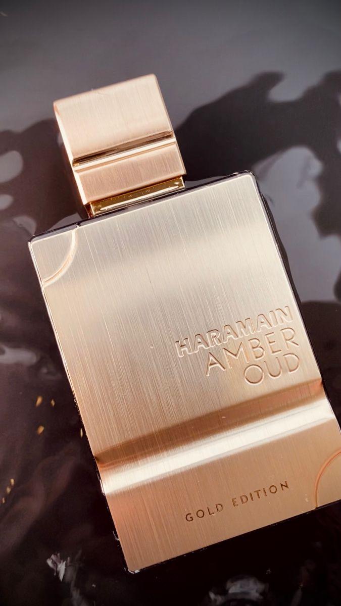 Al Haramain Amber Oud Gold Edition perfume bottle for men and women, featuring a gold cap and elegant design, 100ml.