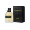 Valentino Uomo Born In Roma Yellow Dream Eau De Toilette 100ml for men, yellow bottle with cap, placed on a white surface.