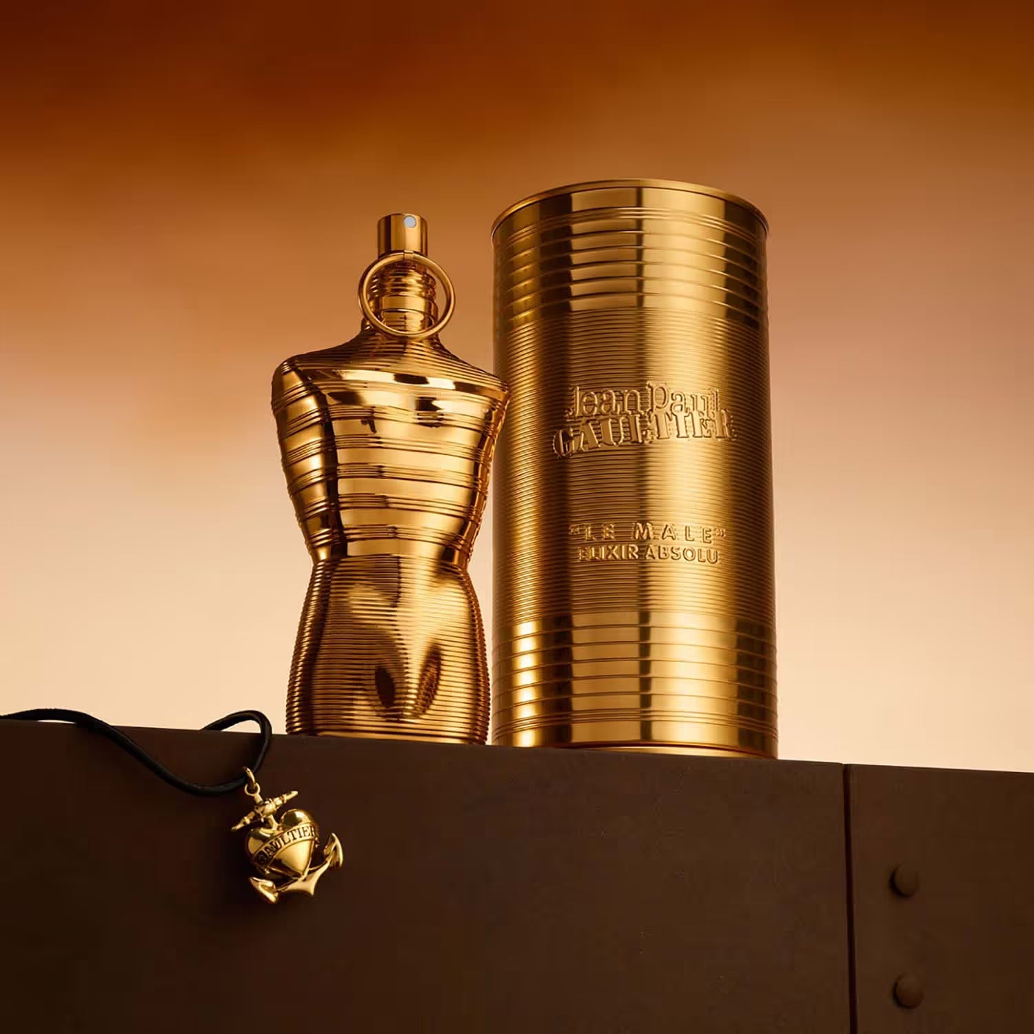 Jean Paul Gaultier Le Male Elixir Absolu Parfum Intense 125ml bottle for men, sleek design with gold accents and elegant label.