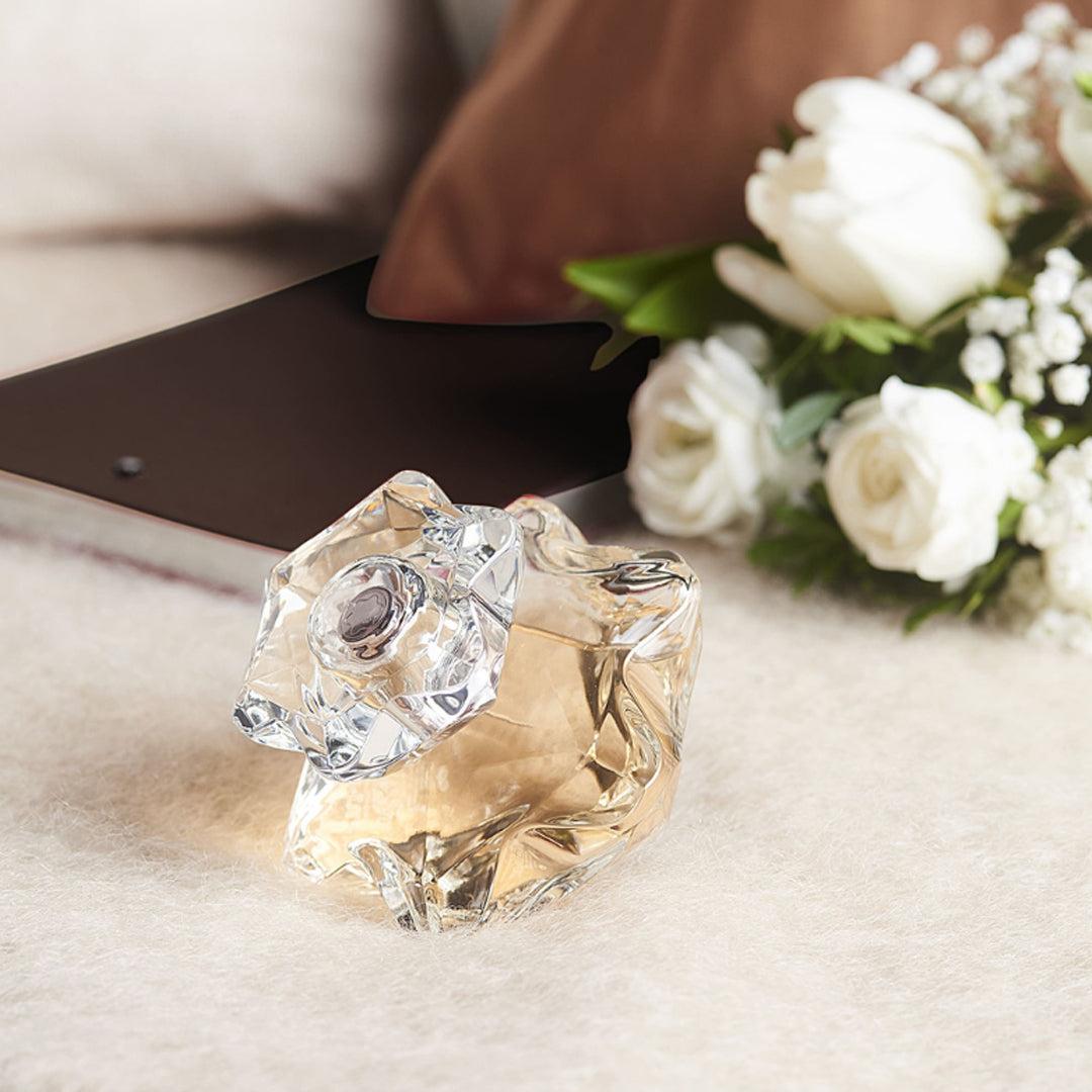 Montblanc Lady Emblem Eau De Parfum bottle, 75ml, with elegant floral design and gold accents on a white background.